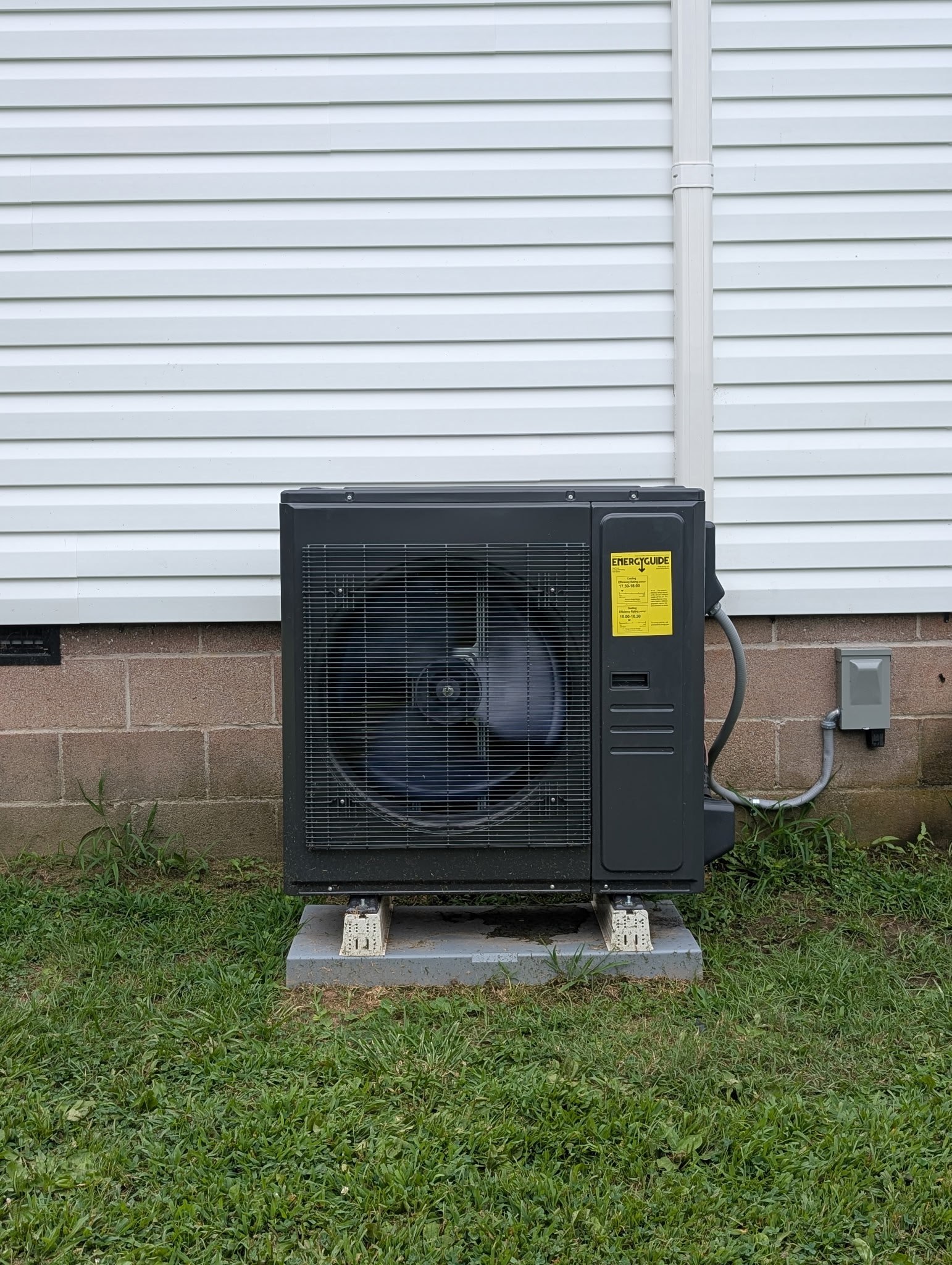Black ACiQ heat pump unit installed by J & L Heating & Cooling in Trenton, TN
