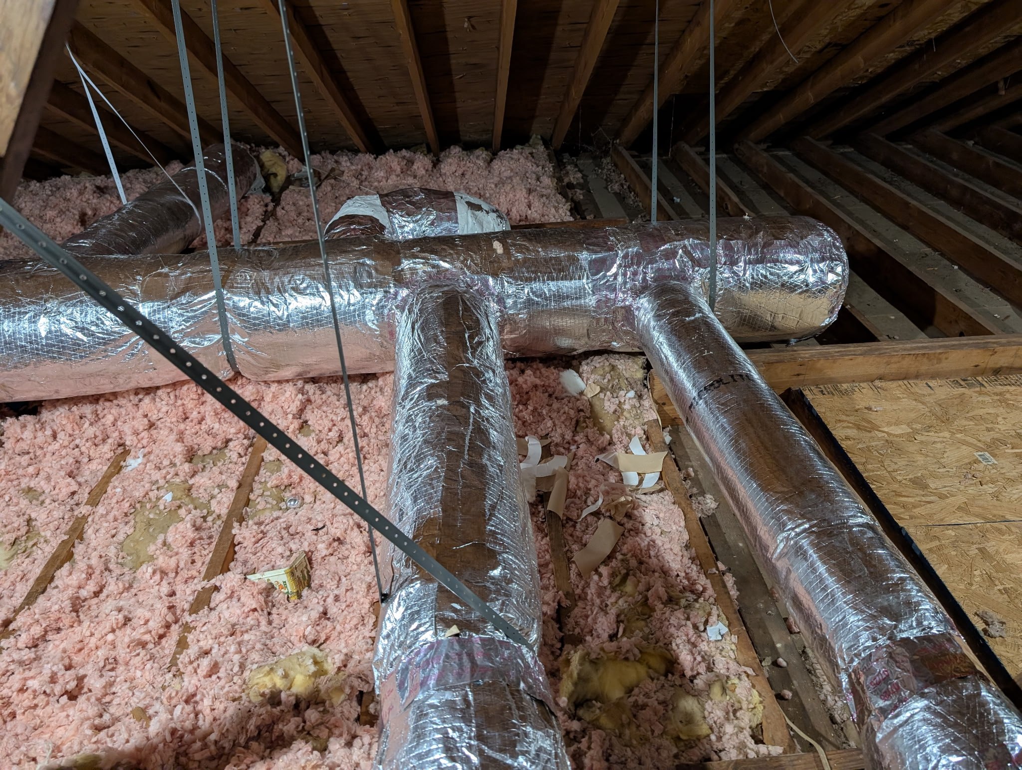 Insulated attic ductwork trunk and branch runs installed by J & L Heating & Cooling in Trenton, TN